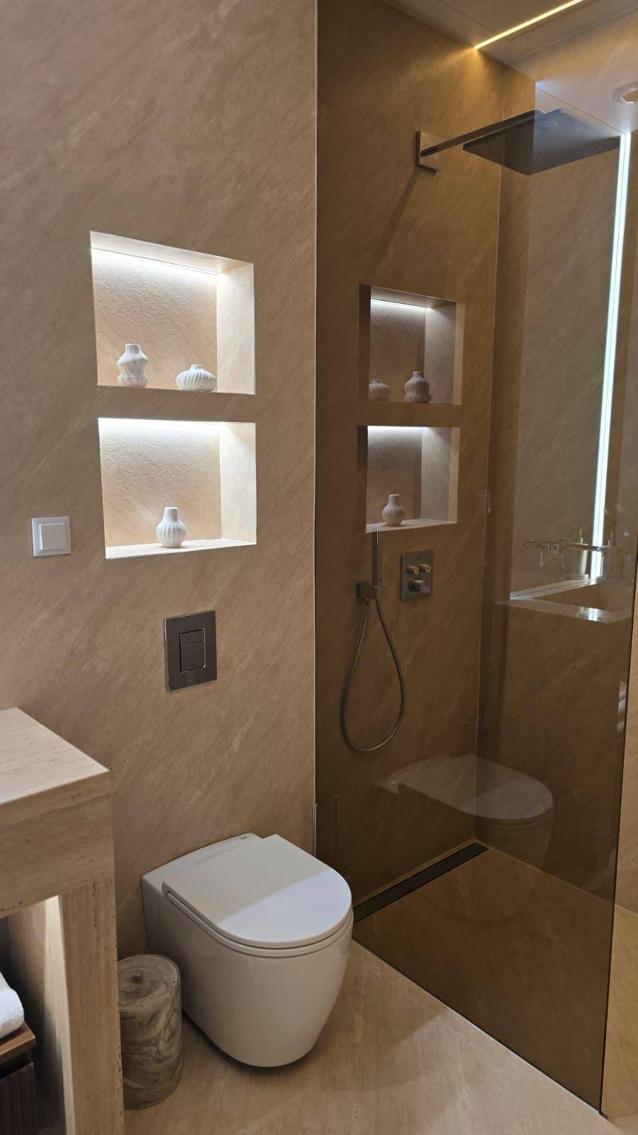 Walk-in shower with lit niches